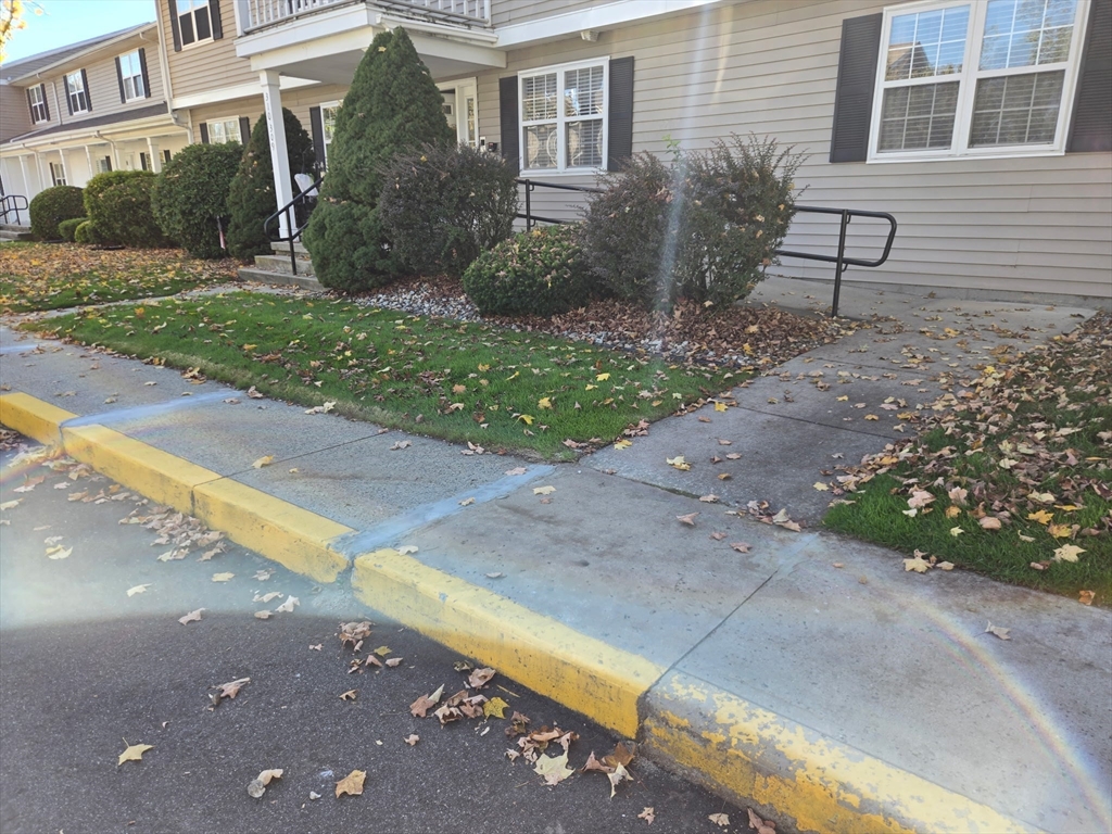 665 Center Street, Unit 311 Ludlow, MA 01056 - Photo 2 of 24 a view of a house with backyard and garden