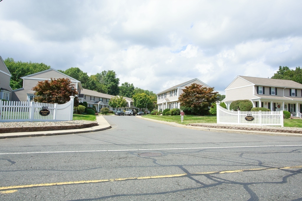 665 Center Street, Unit 311 Ludlow, MA 01056 - Photo 24 of 24 a view of a house with a yard and plants