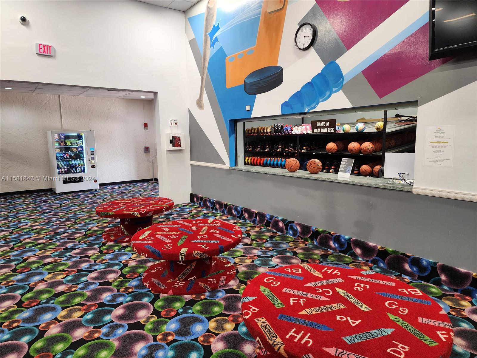 296 Racquet Club Road, Unit 203 Weston, FL 33326 - Photo 35 of 43 a room with lots of different colored cloths