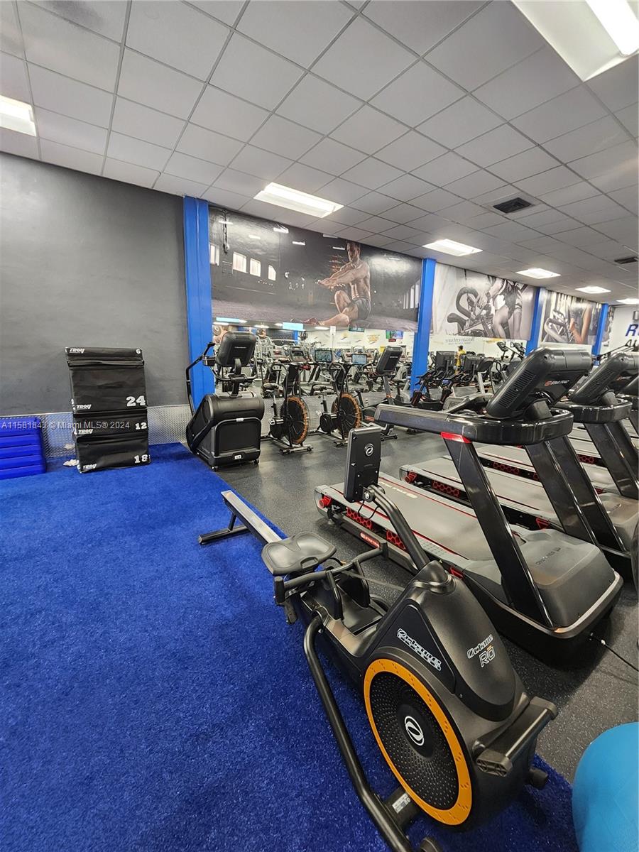 296 Racquet Club Road, Unit 203 Weston, FL 33326 - Photo 39 of 43 a view of a room with gym equipment