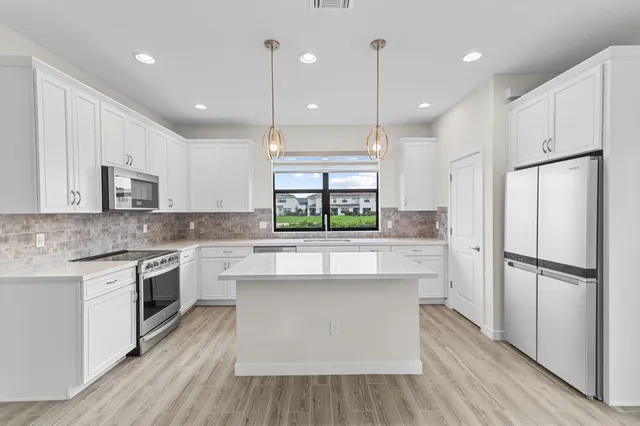 a view of a house with a big yard