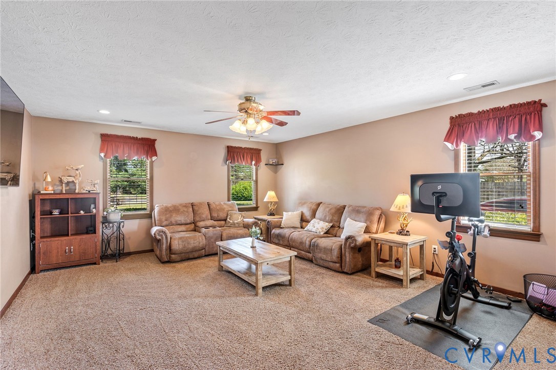 3411 Spring Run Road Mechanicsville, VA 23111 - Photo 23 of 41 a living room with furniture and a flat screen tv