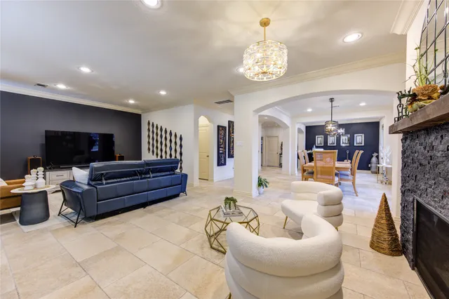 a living room with fireplace furniture and a flat screen tv