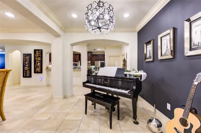 a living room with a couch and a chandelier