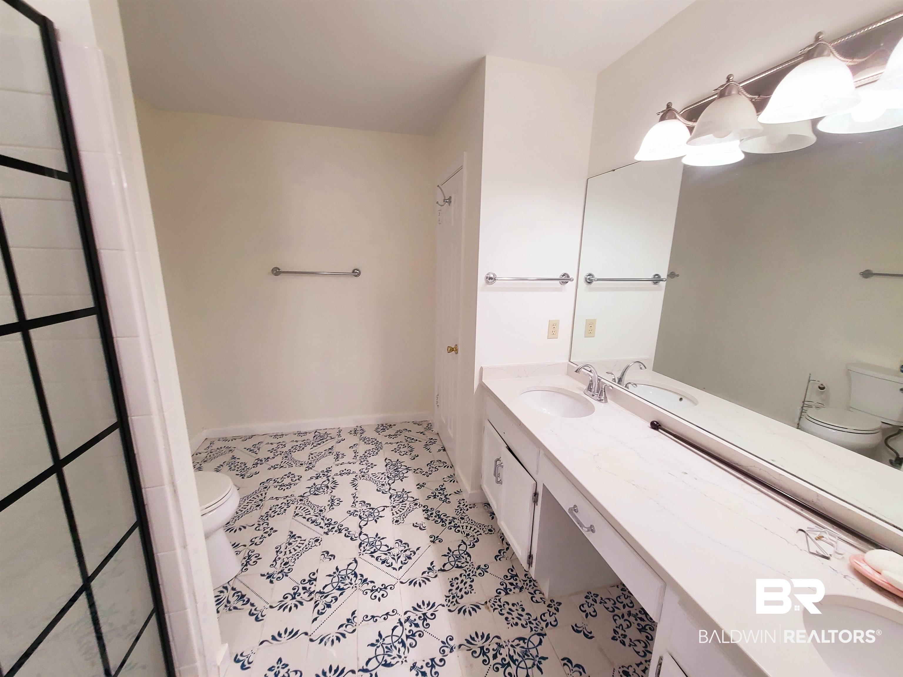 123 Melanie Loop Daphne, AL 36526 - Photo 9 of 17 Full bathroom featuring double vanity, a shower, and light tile patterned floors