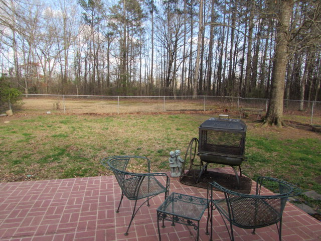 420 Fairview Church Road Forsyth, GA 31029 - Photo 12 of 12 a backyard of a house with table and chairs
