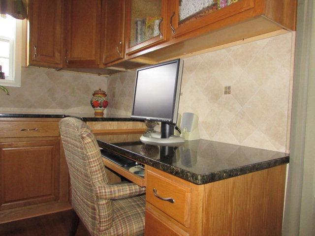420 Fairview Church Road Forsyth, GA 31029 - Photo 4 of 12 a kitchen with granite countertop a sink and cabinets