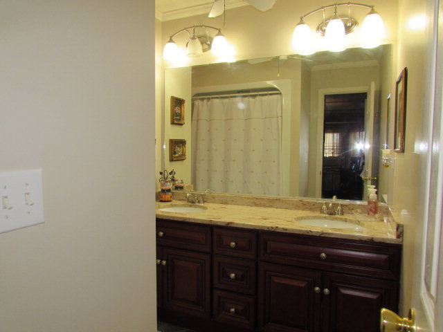 420 Fairview Church Road Forsyth, GA 31029 - Photo 8 of 12 a bathroom with a granite countertop sink and a mirror
