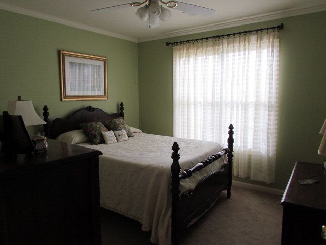 420 Fairview Church Road Forsyth, GA 31029 - Photo 9 of 12 a bed room with a bed and a window