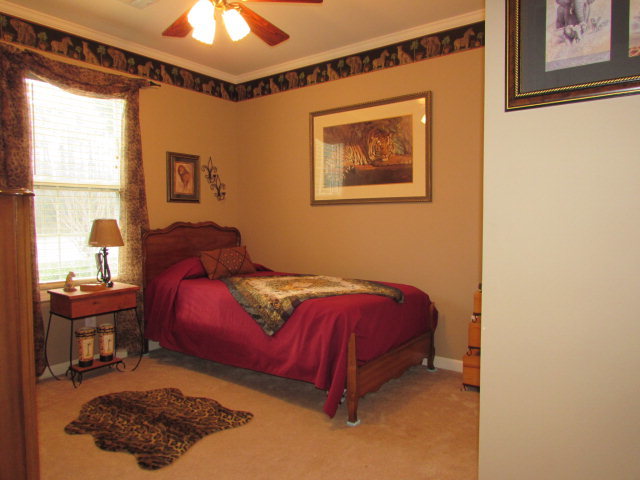 420 Fairview Church Road Forsyth, GA 31029 - Photo 10 of 12 a bedroom with a bed and a window