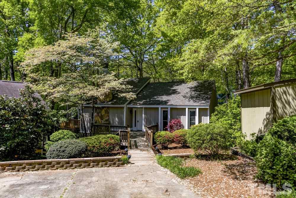 2921 Rue Sans Famille Raleigh, NC 27607 - Photo 1 of 15 front view of a house with a small yard