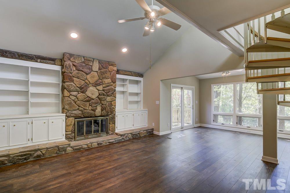 2921 Rue Sans Famille Raleigh, NC 27607 - Photo 2 of 15 a view of an empty room with a window and wooden floor
