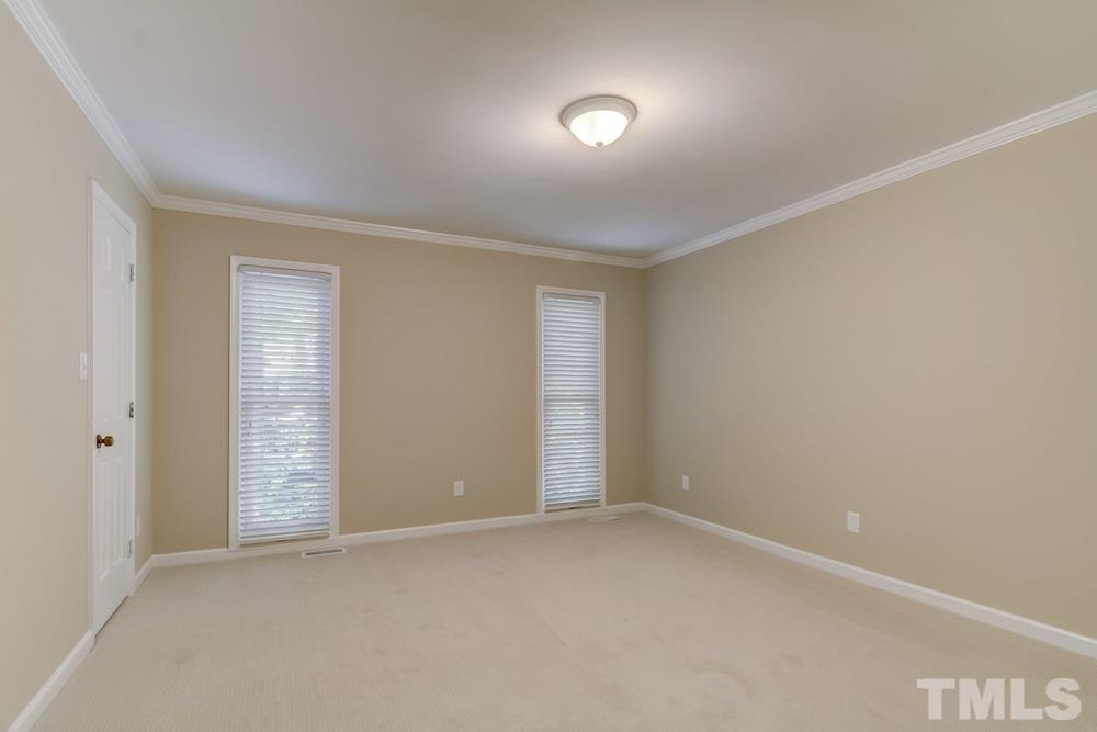 2921 Rue Sans Famille Raleigh, NC 27607 - Photo 12 of 15 an empty room with windows and closet