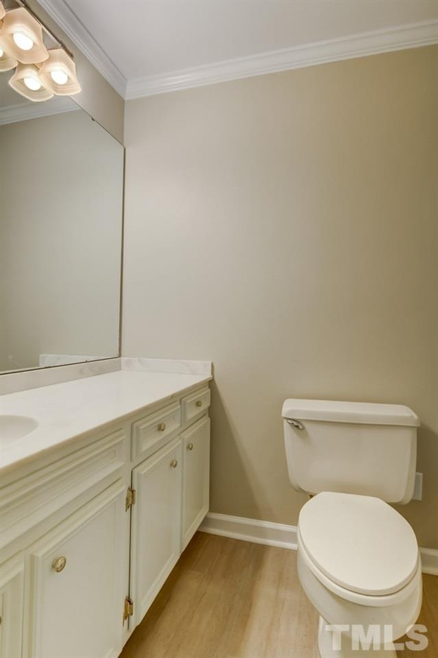 2921 Rue Sans Famille Raleigh, NC 27607 - Photo 13 of 15 a white toilet sitting next to a window