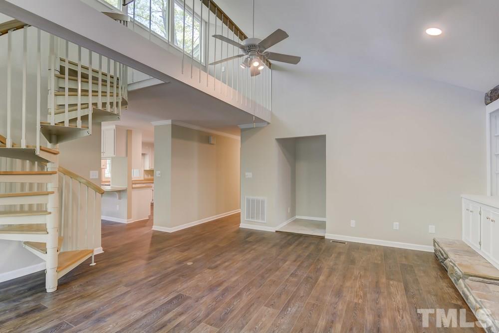 2921 Rue Sans Famille Raleigh, NC 27607 - Photo 3 of 15 wooden floor in an empty room with a window
