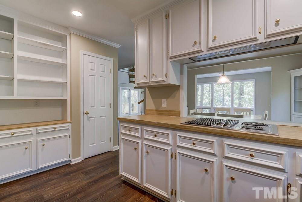 2921 Rue Sans Famille Raleigh, NC 27607 - Photo 9 of 15 a kitchen with white cabinets and sink