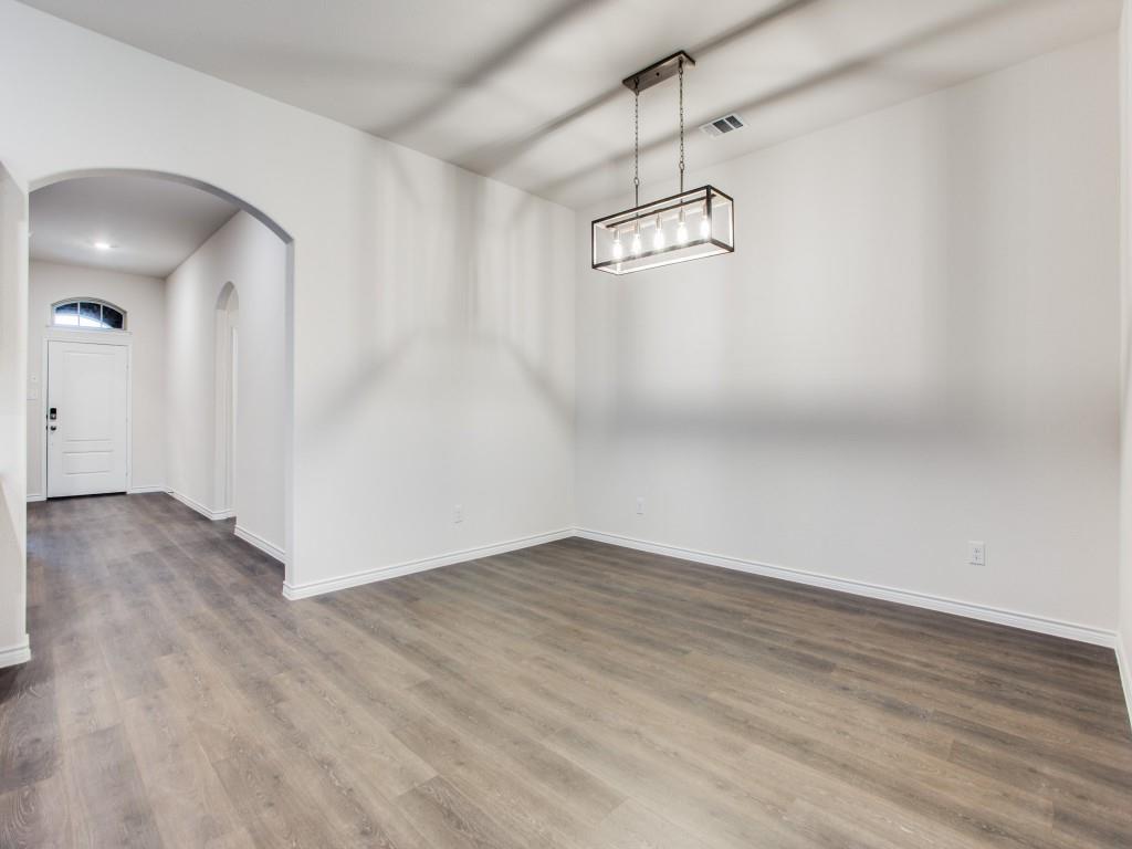 123 Lakeview Circle Pilot Point, TX 76258 - Photo 8 of 39 a view of a room with wooden floor