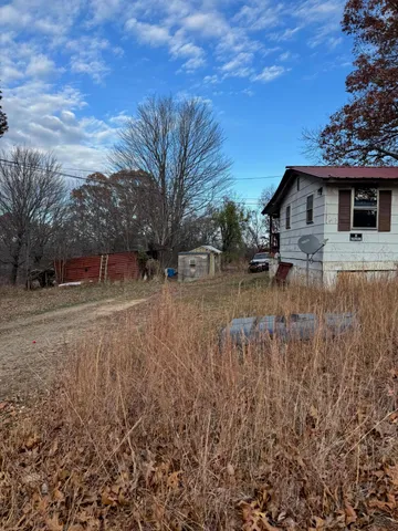 a backyard of a house with lots of green space