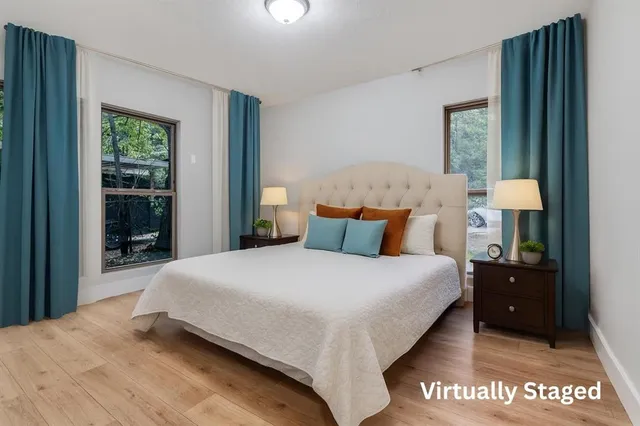 a bedroom with a bed and window