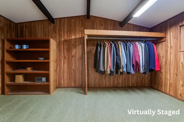 a view of a room with clothes and shoes