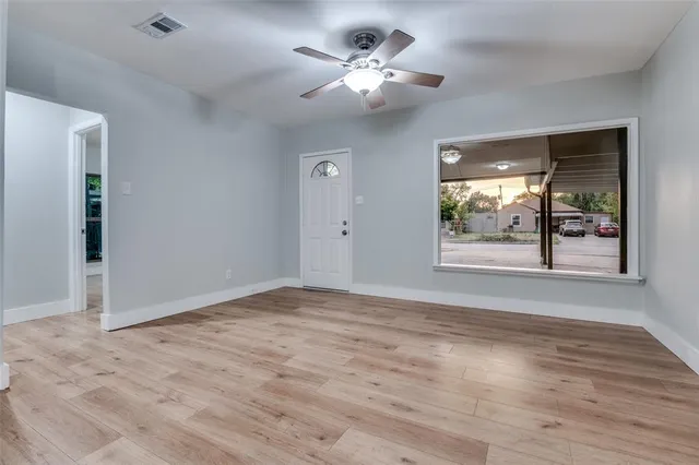 a view of an empty room with a window
