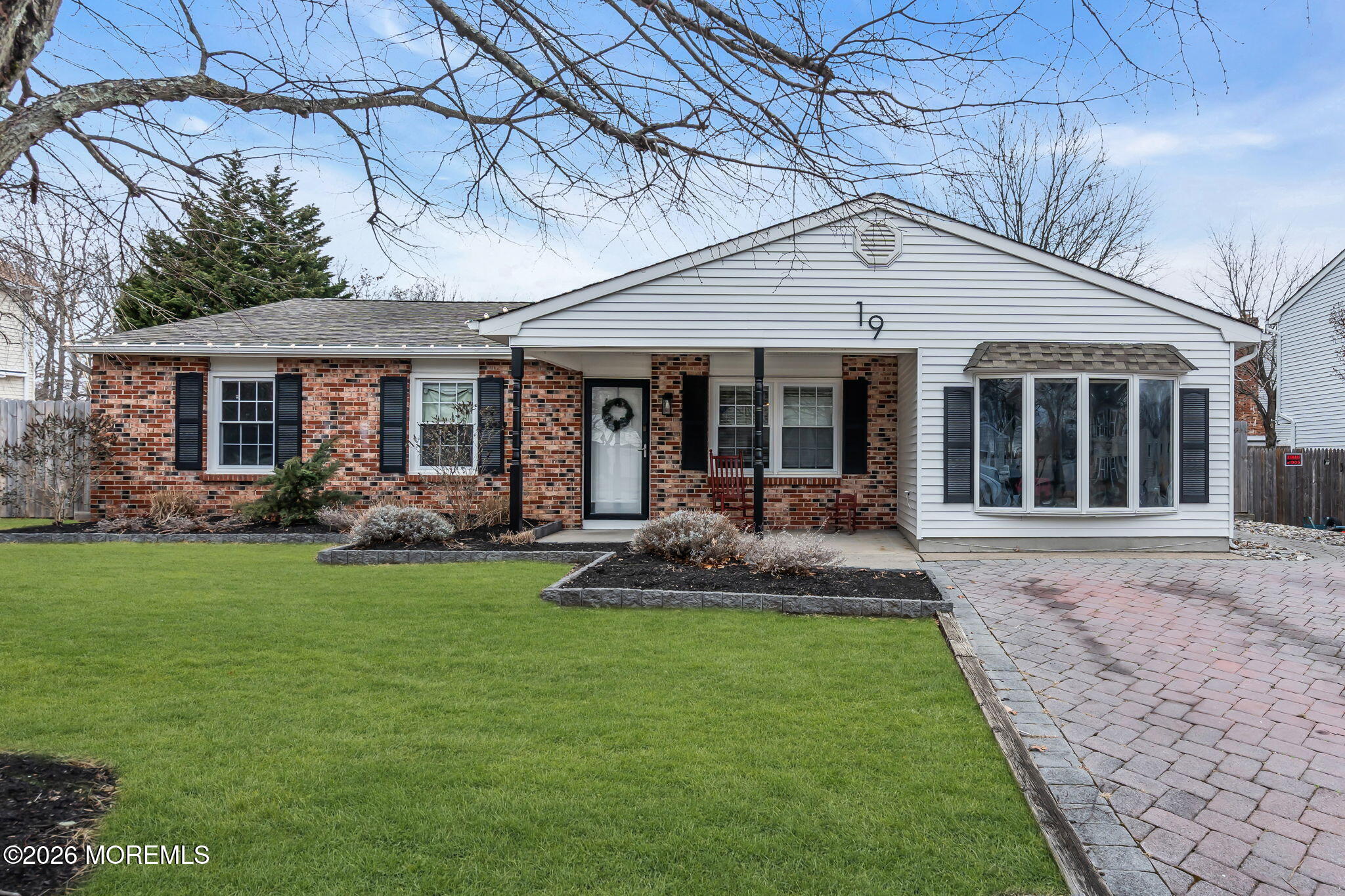 19 Virginia Drive Howell, NJ 07731 - Photo 1 of 38 a front view of a house with a yard and porch