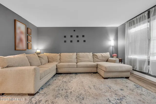 a living room with furniture and window