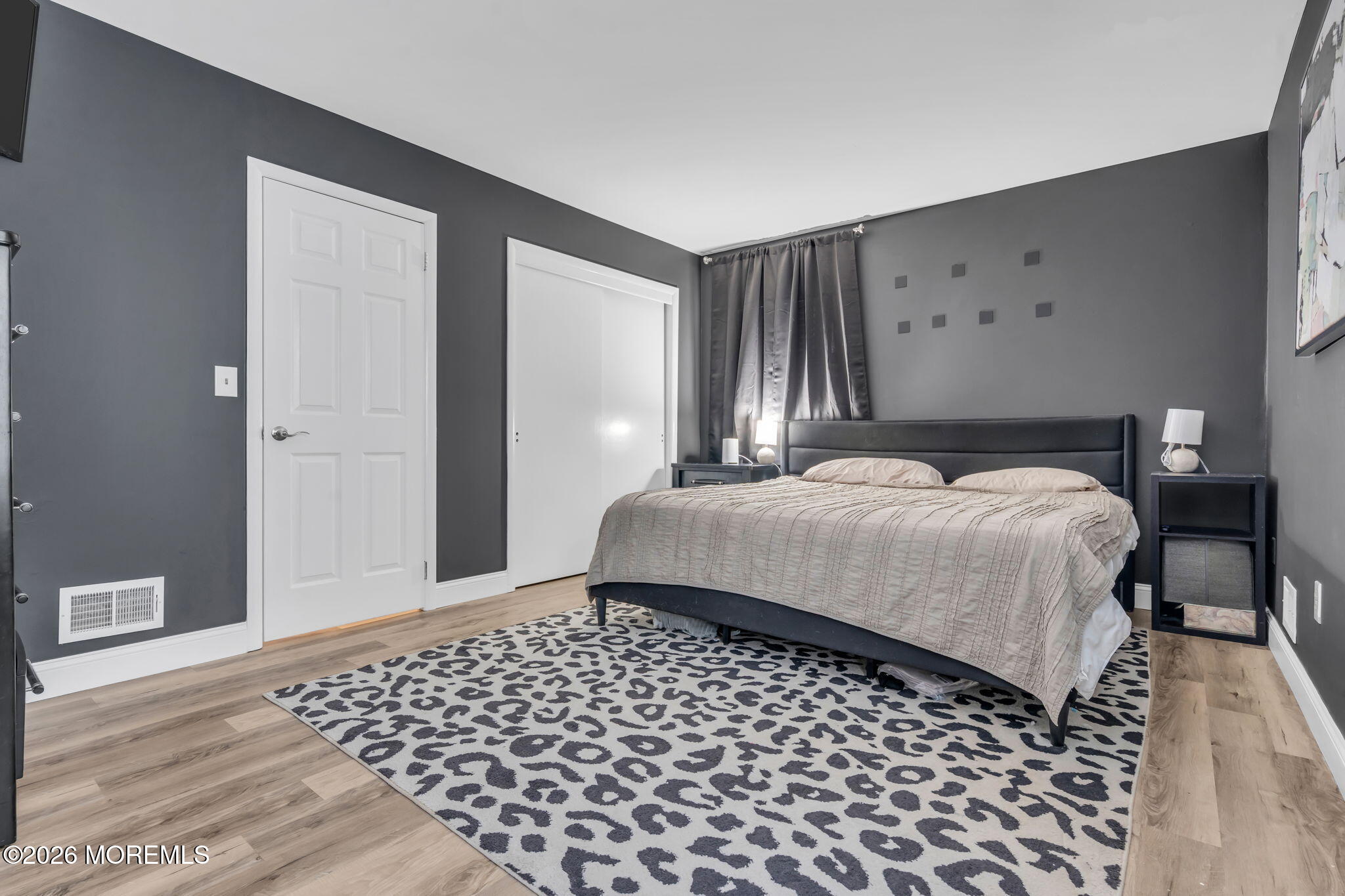 19 Virginia Drive Howell, NJ 07731 - Photo 24 of 38 a bedroom with a bed and wooden floor