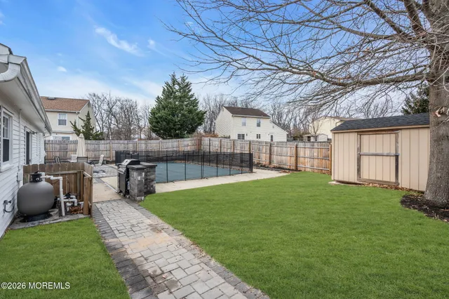 a house view with a sitting space and garden