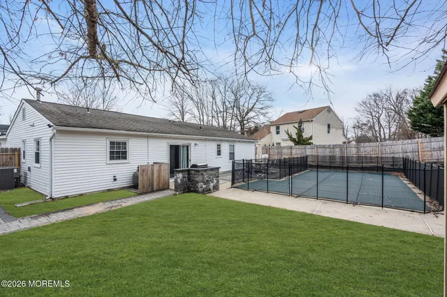 a view of a backyard with a sitting area