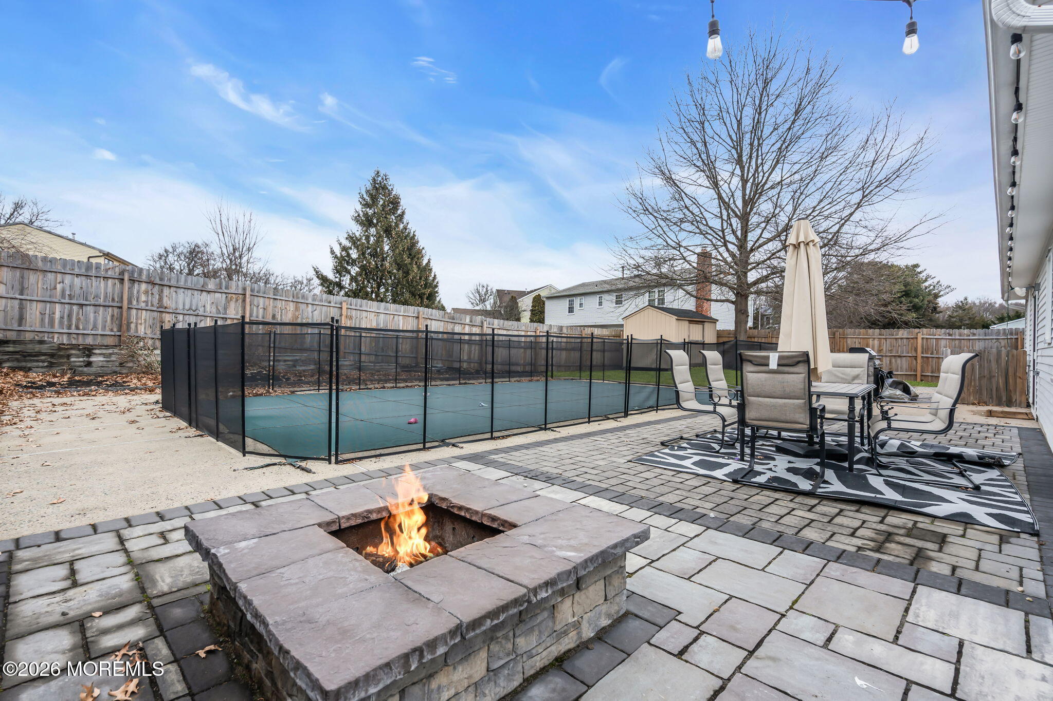 19 Virginia Drive Howell, NJ 07731 - Photo 36 of 38 a view of a patio with a table and chairs