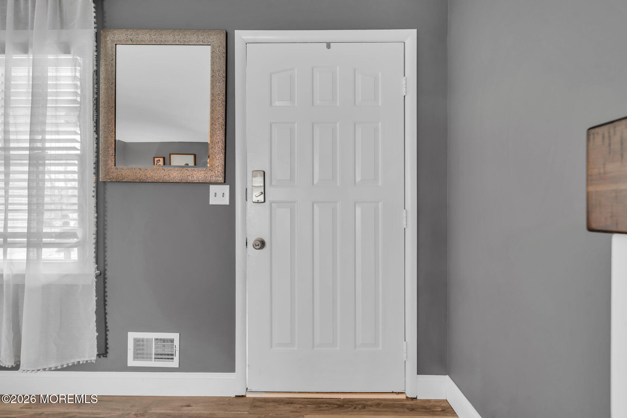 19 Virginia Drive Howell, NJ 07731 - Photo 7 of 38 a view of a hallway with wooden floor