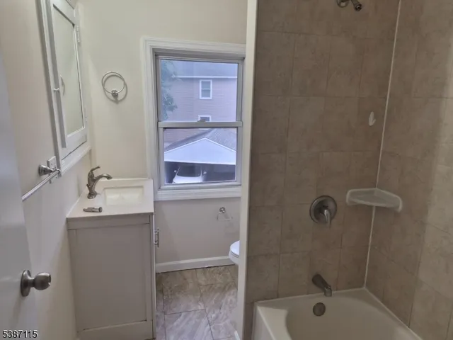 a kitchen with a refrigerator and a stove