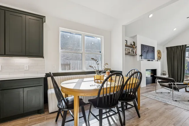a view of a dining room with furniture and window