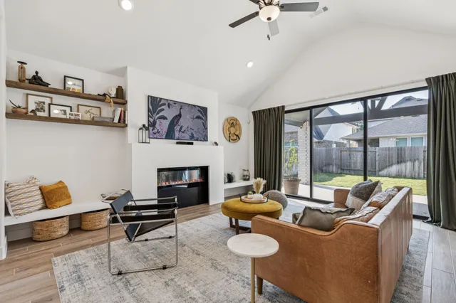 a view of a dining room with furniture and a window
