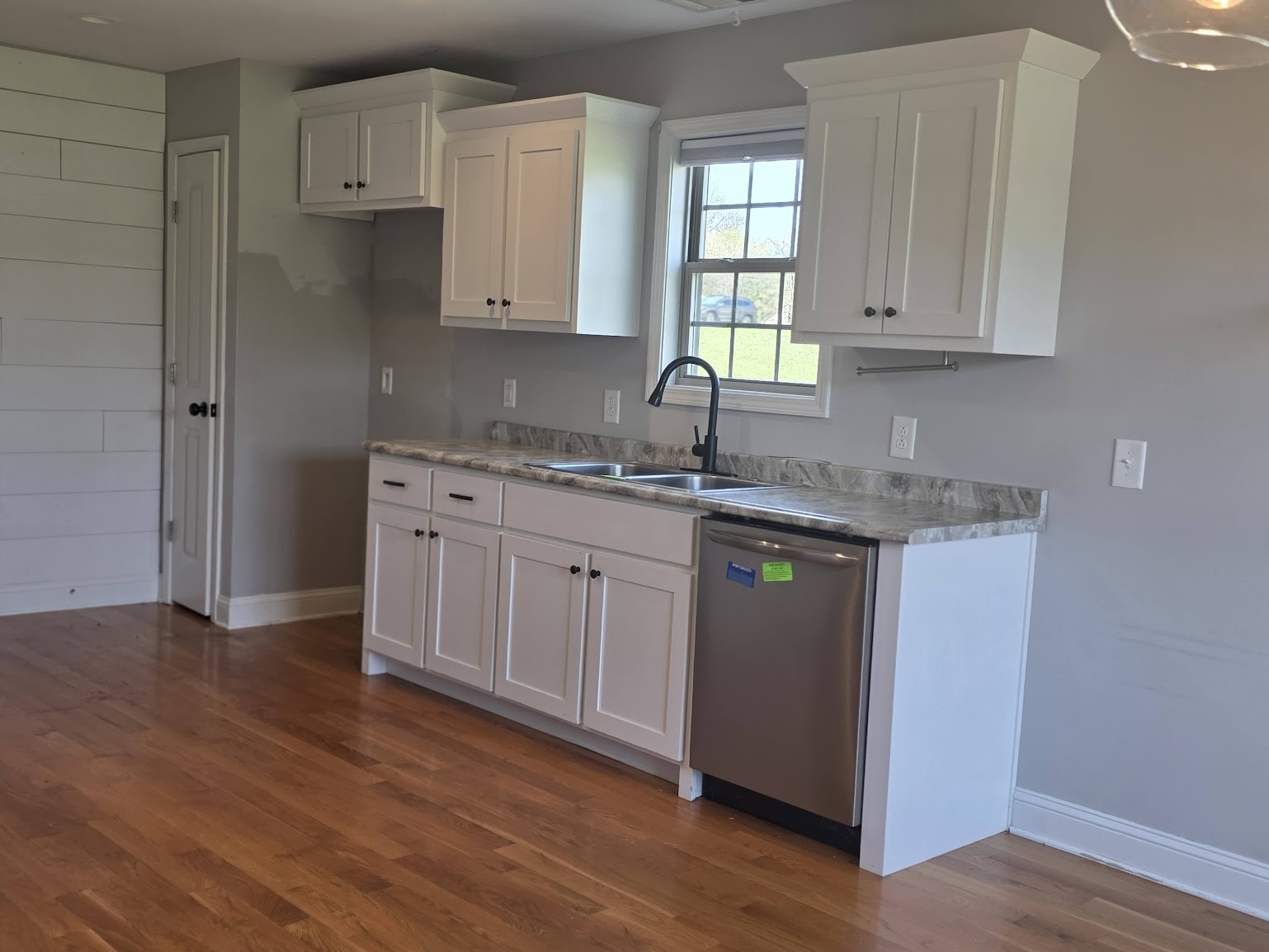 4927 Minnis Road Springfield, TN 37172 - Photo 6 of 15 a kitchen with stainless steel appliances granite countertop a sink a stove and cabinets