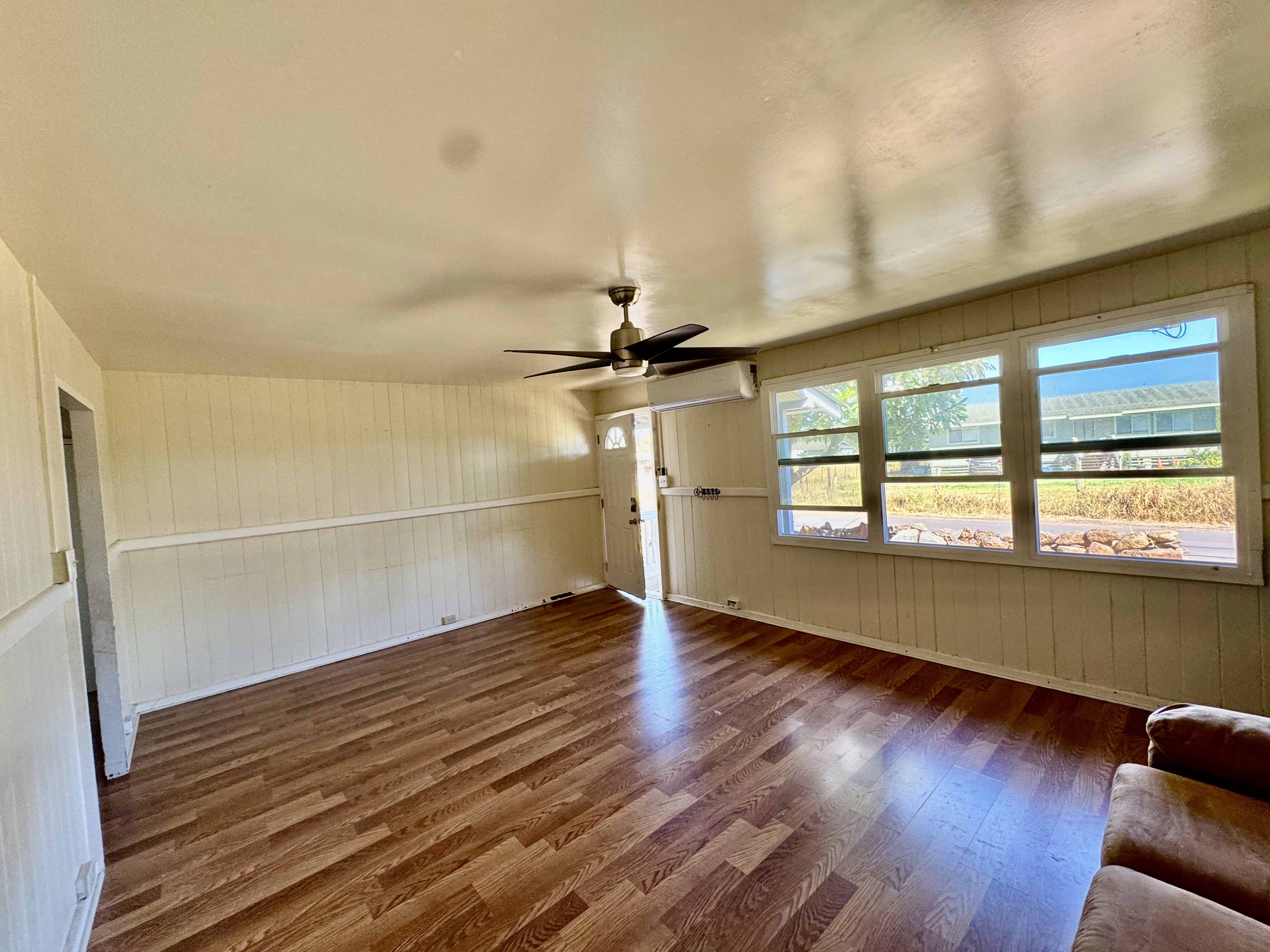4611 Menehune Road, Unit 2 Waimea, HI 96796 - Photo 12 of 25 a view of empty room with wooden floor and fan