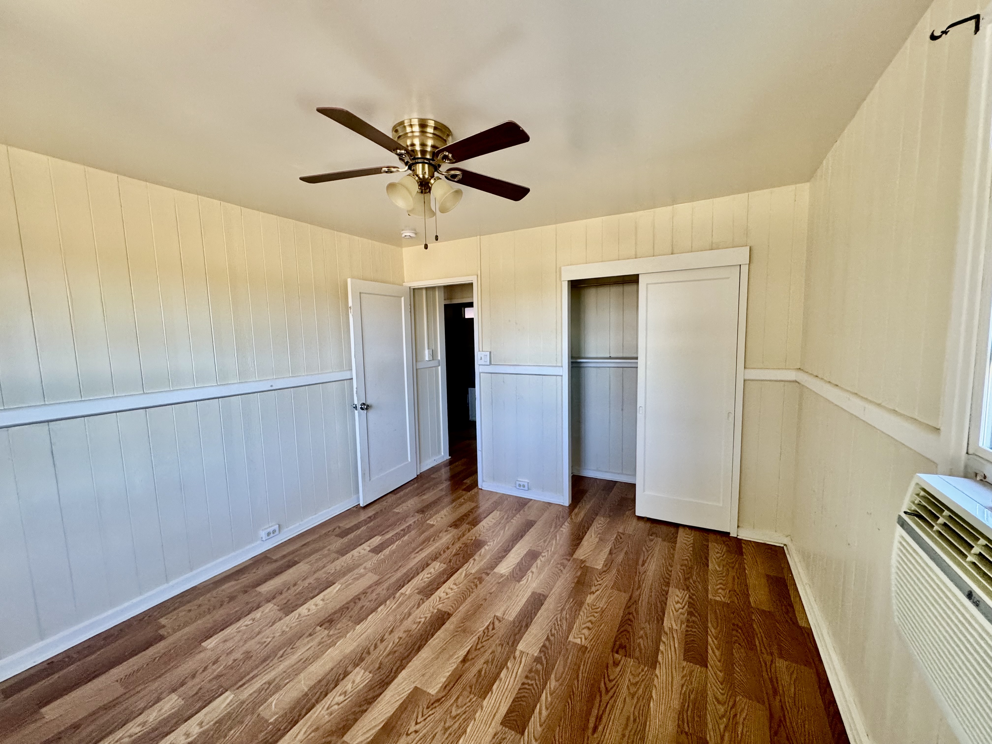 4611 Menehune Road, Unit 2 Waimea, HI 96796 - Photo 19 of 25 a view of empty room with wooden floor