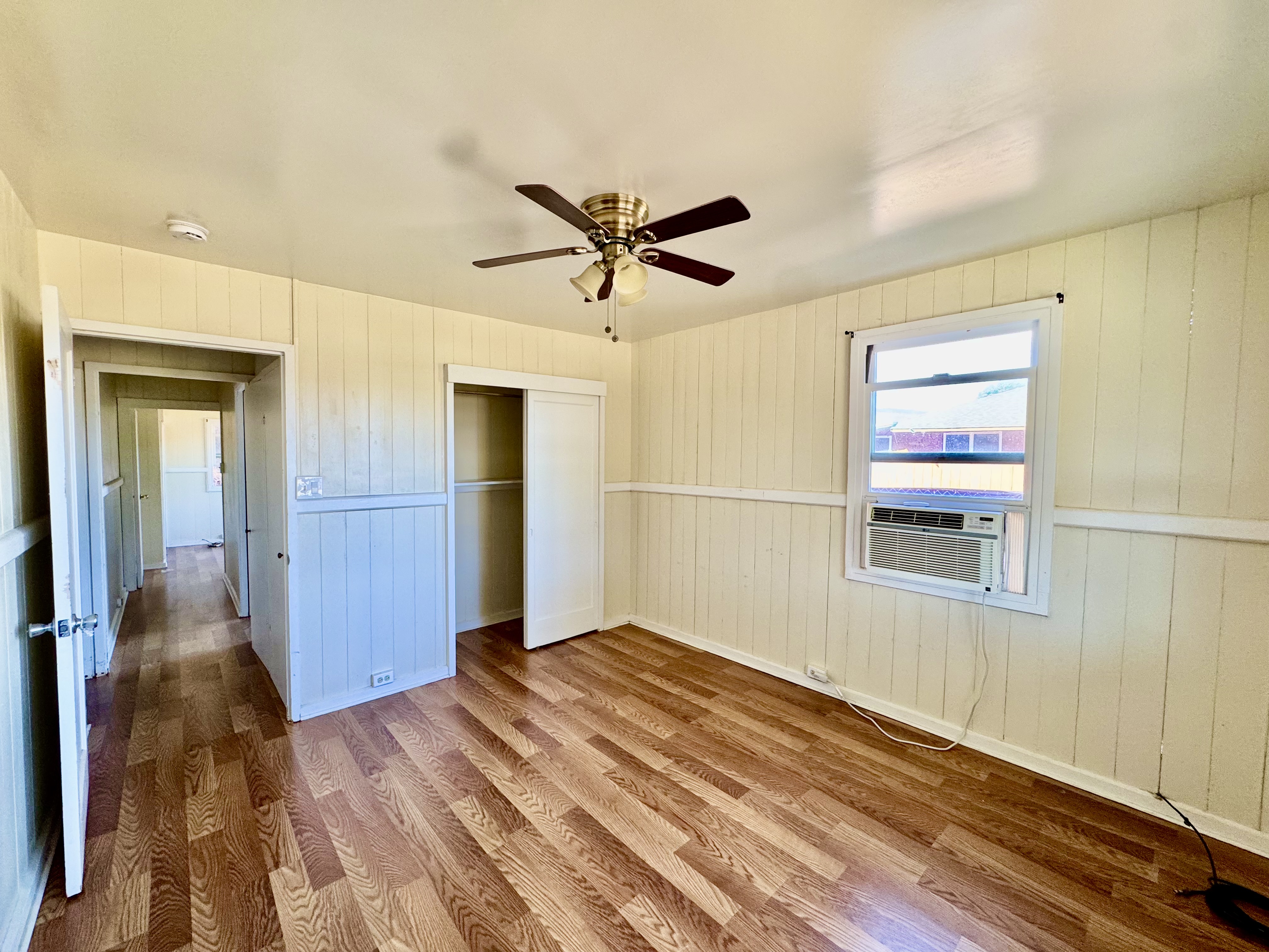 4611 Menehune Road, Unit 2 Waimea, HI 96796 - Photo 20 of 25 wooden floor in an empty room with a window