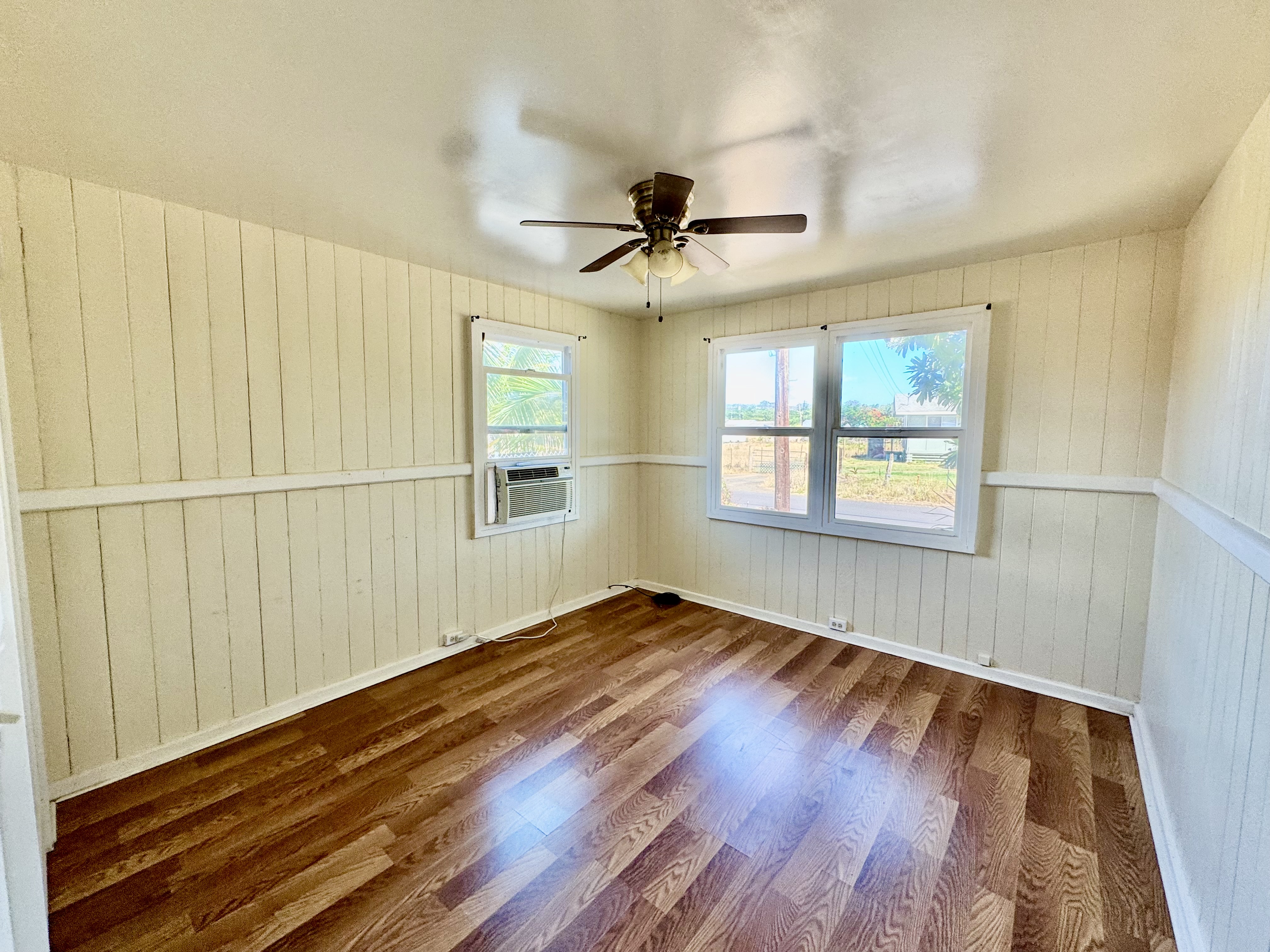 4611 Menehune Road, Unit 2 Waimea, HI 96796 - Photo 21 of 25 wooden floor in an empty room with a window
