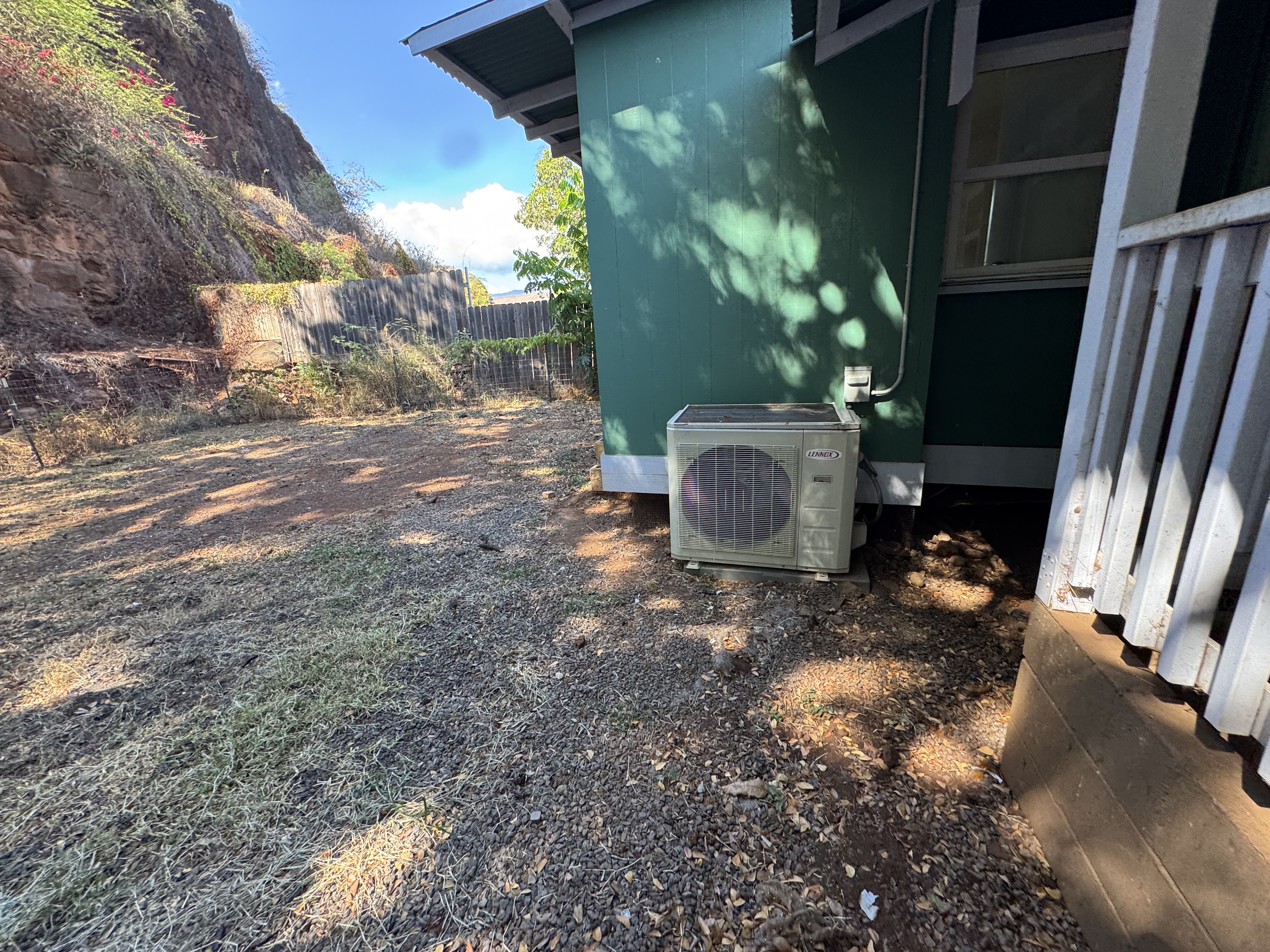 4611 Menehune Road, Unit 2 Waimea, HI 96796 - Photo 25 of 25 a backyard of a house with lots of green space