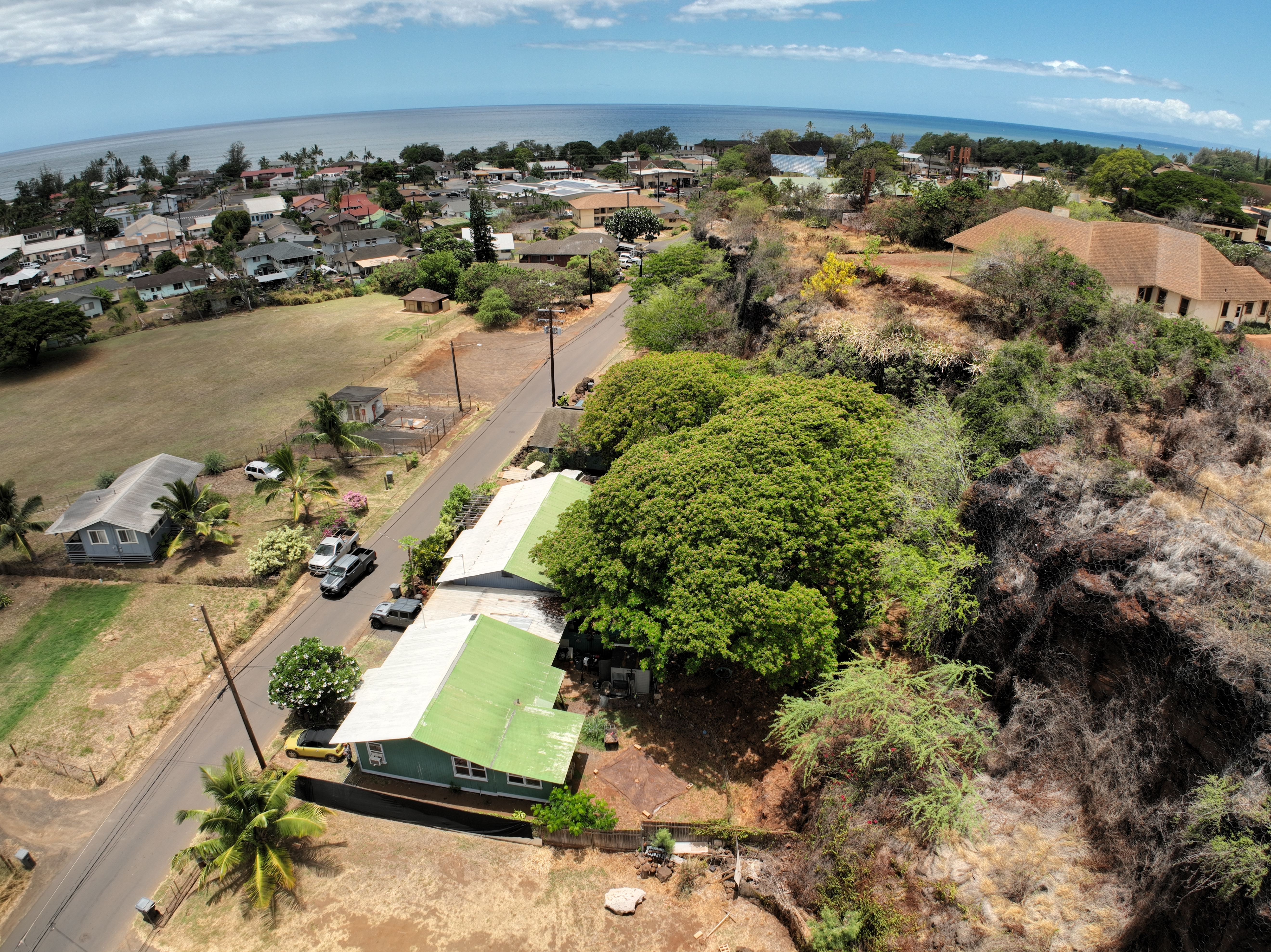 4611 Menehune Road, Unit 2 Waimea, HI 96796 - Photo 5 of 25 an aerial view of a house with a yard and lake view