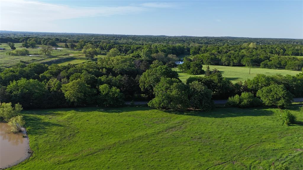 1 Dripping Springs Road Denison, TX 75021 - Photo 16 of 20 a view of a grassy field with trees