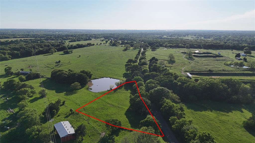 1 Dripping Springs Road Denison, TX 75021 - Photo 18 of 20 an aerial view of a house with a yard