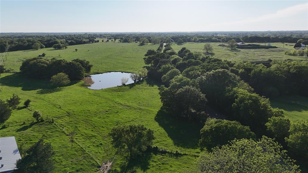 1 Dripping Springs Road Denison, TX 75021 - Photo 3 of 20 a view of a lake with a yard