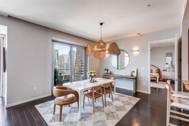 a view of a dining room with furniture window and wooden floor