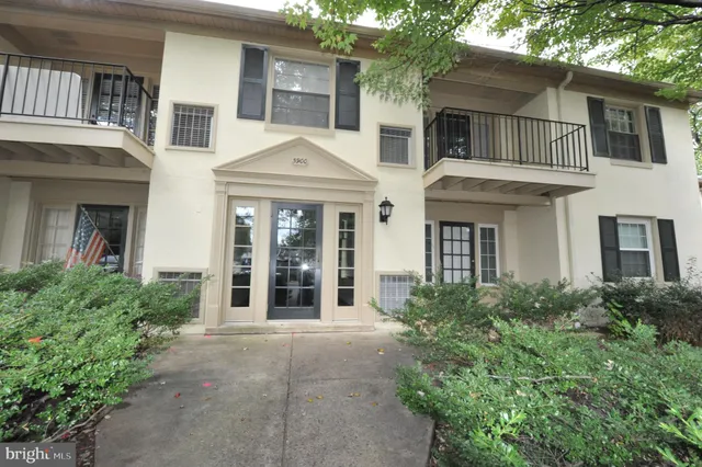 front view of a brick house with a large windows
