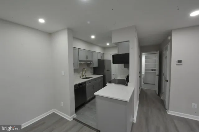 front view of a brick house with a yard