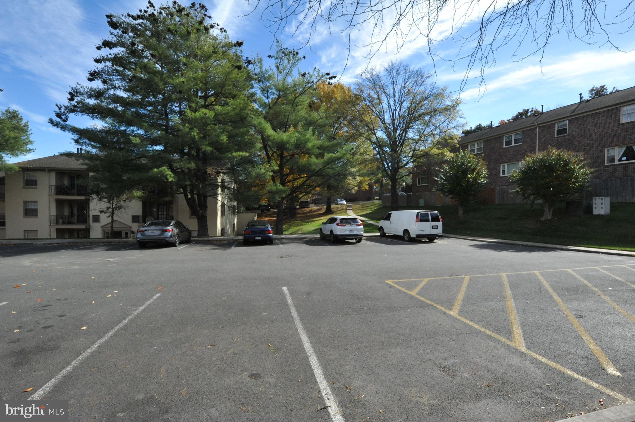 5900 K Surrey Hill Place, Unit 697 Springfield, VA 22152 - Photo 23 of 32 a car parked on the side of a street