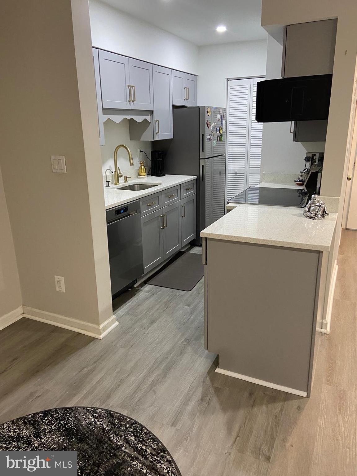 5900 K Surrey Hill Place, Unit 697 Springfield, VA 22152 - Photo 4 of 32 a utility room with sink dryer and washer